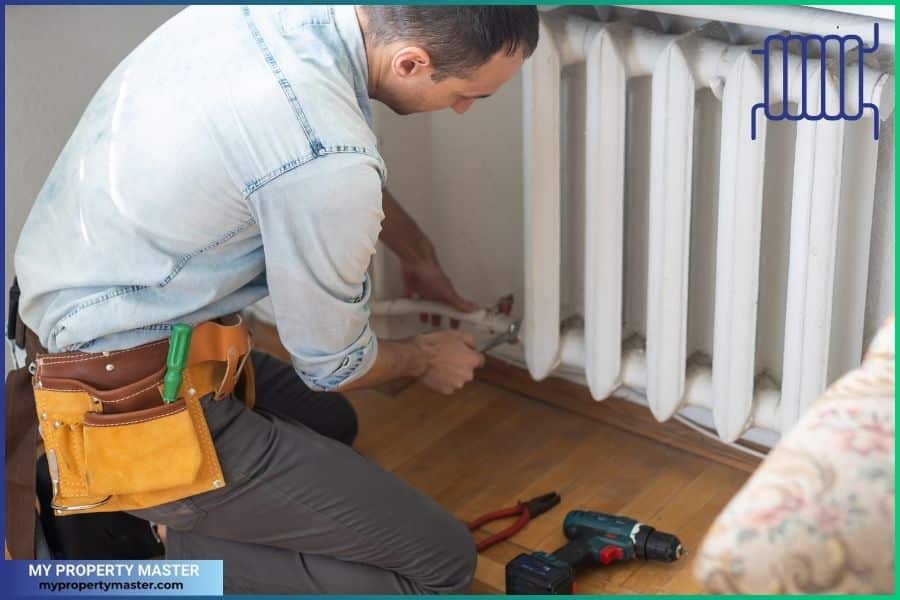 Man repairing radiator