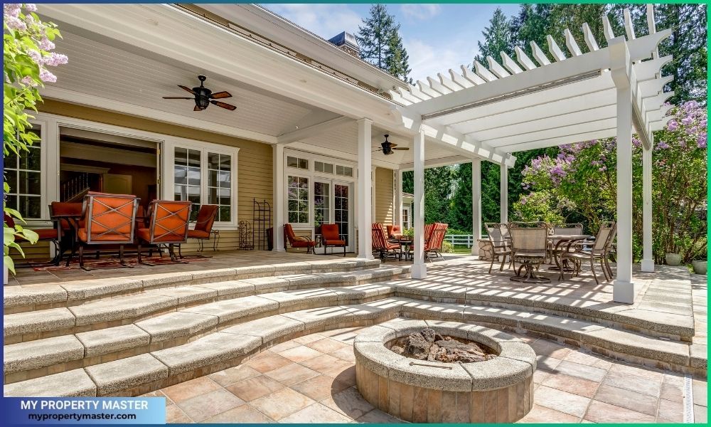 Lovely outdoor deck patio space with white dining pergola